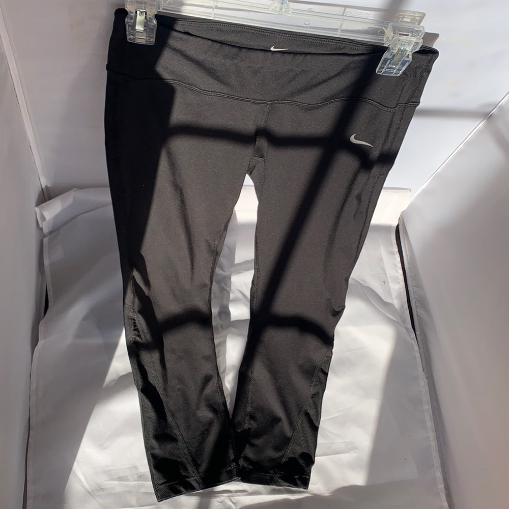 Nike workout leggings. Including zipper in the back and mesh on the bottom